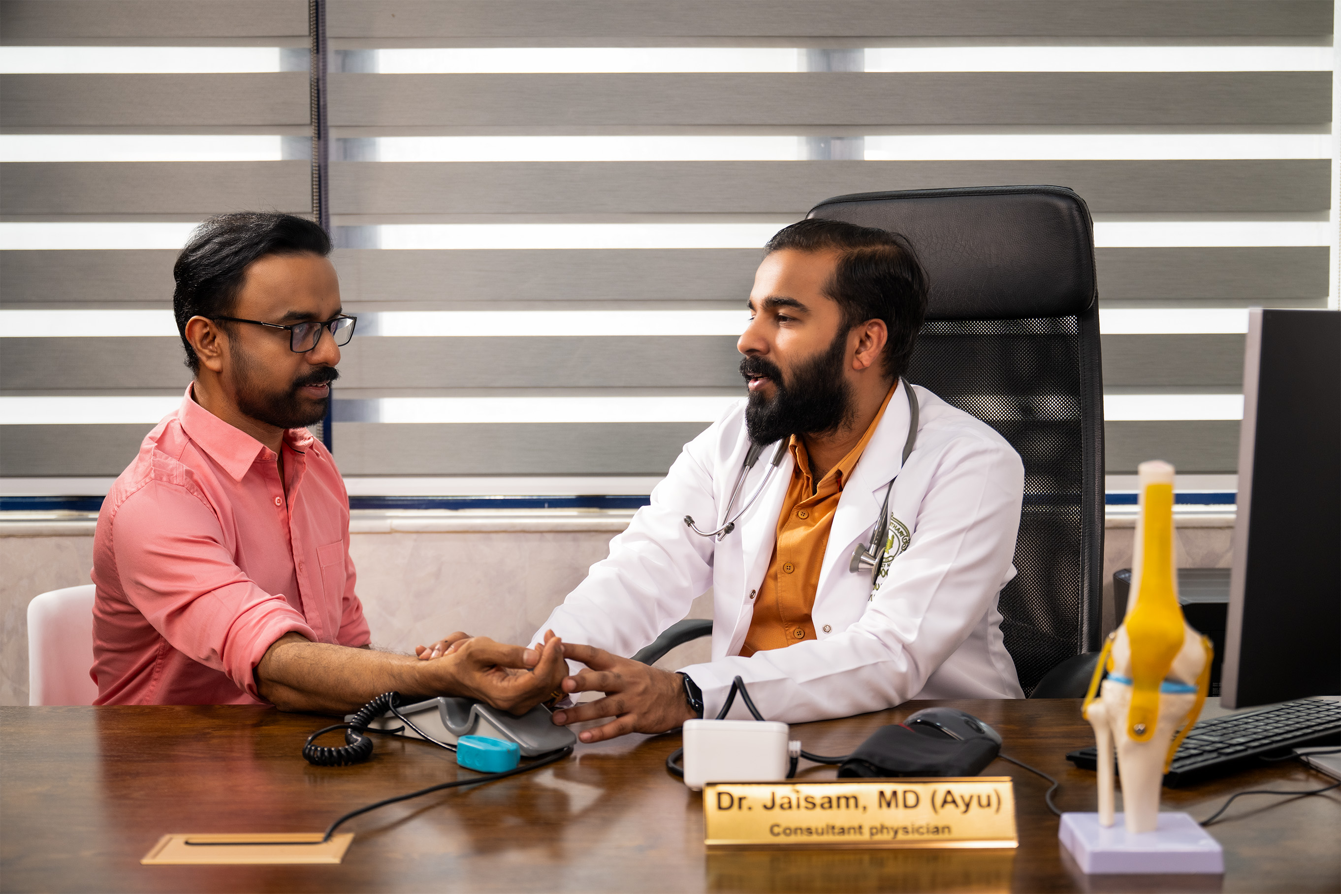 Ayurvedic doctor providing personalized consultation at Dhanwanthari Ayurveda